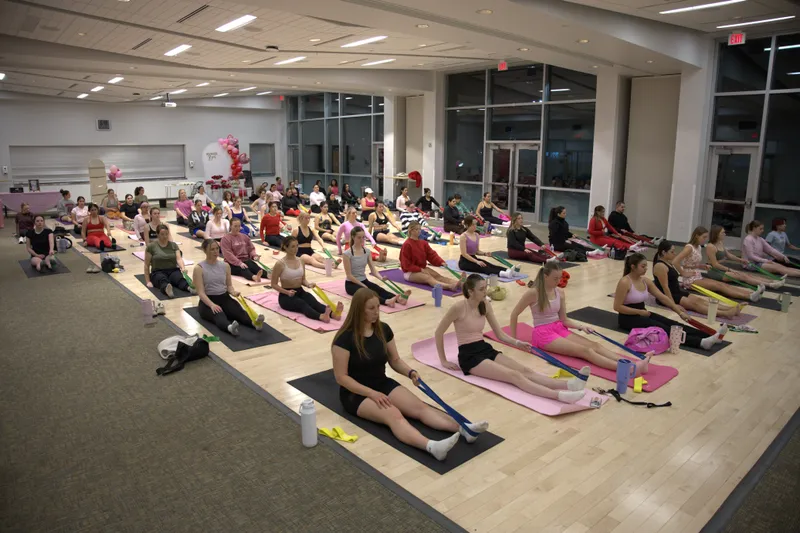 Pilates & Petals: Galentine's Night in Provo, Utah — a room full of people at Abby's pilates event