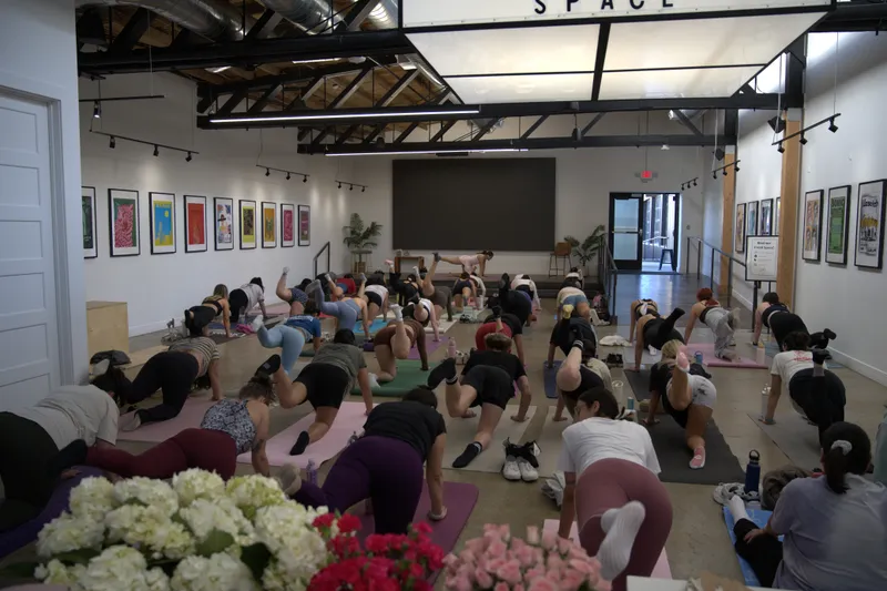 Pilates & Petals: Mother's Day in Provo, Utah — a room full of people at Abby's pilates event